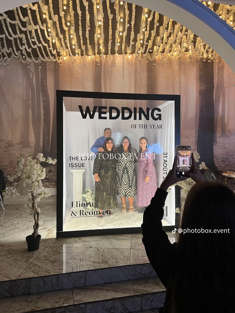 Guests posing inside a real magazine-cover booth